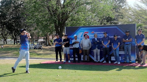  Philippine Airlines assistant vice president for brand management, hits the ceremonial ball ushering in the PAL Seniors Interclub golf team championships in Cagayan de Oro City. 