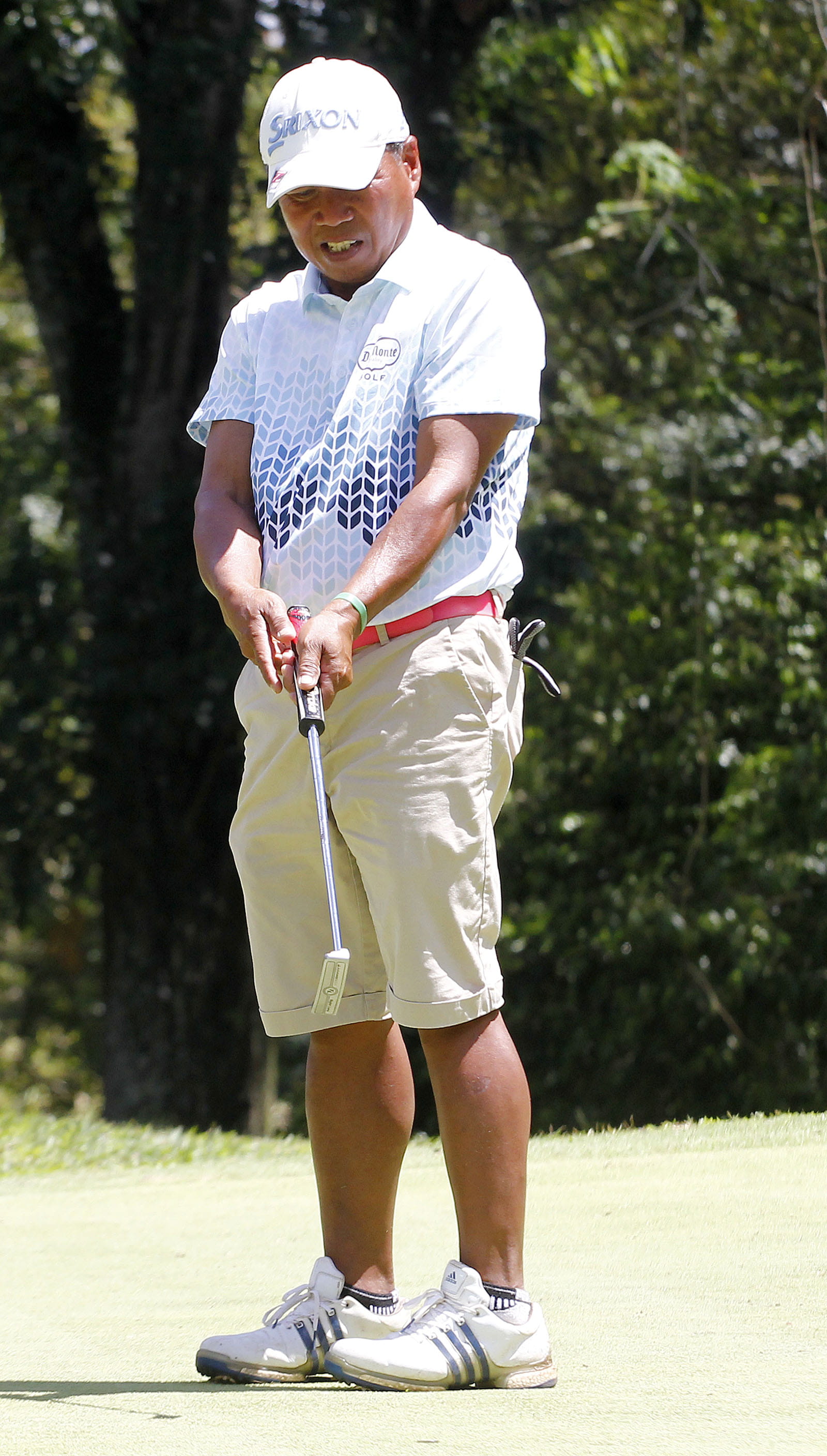 Crispin Aparilla holding a golf club